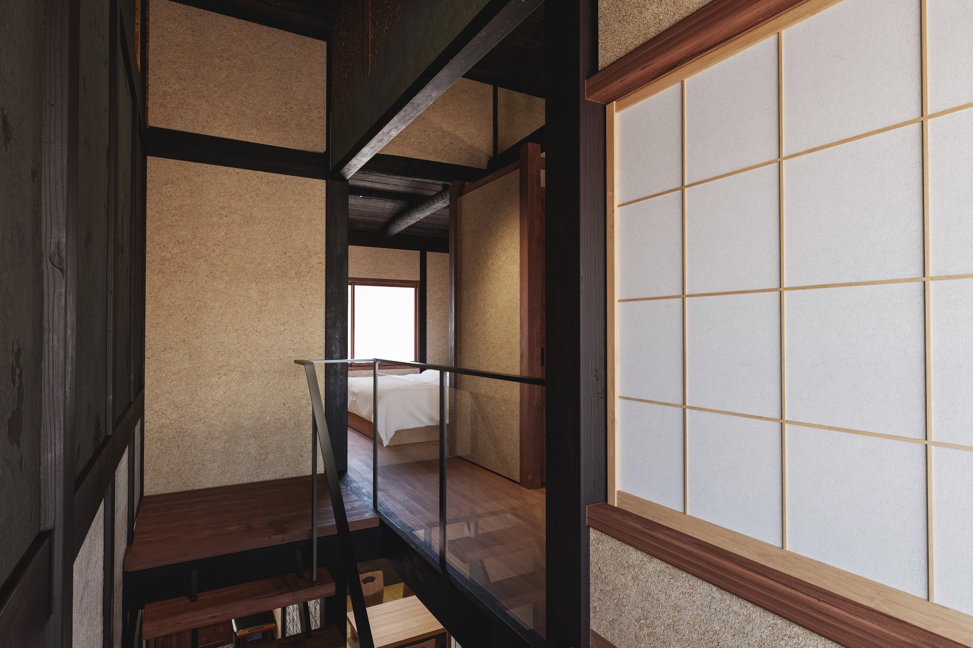 Shoji and open space connect the rooms upstairs.