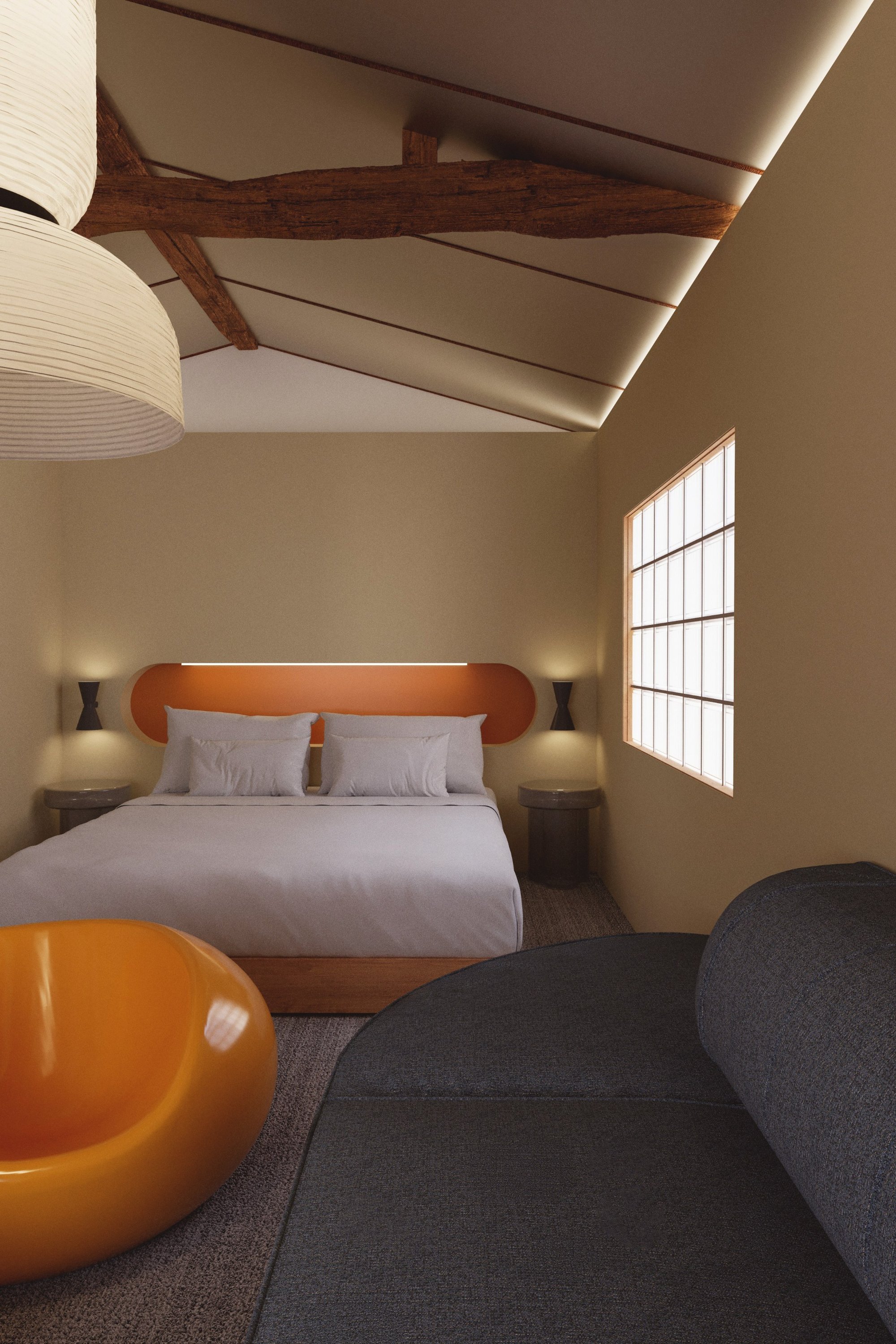 Exposed timber beams frame the bedroom and lounge.
