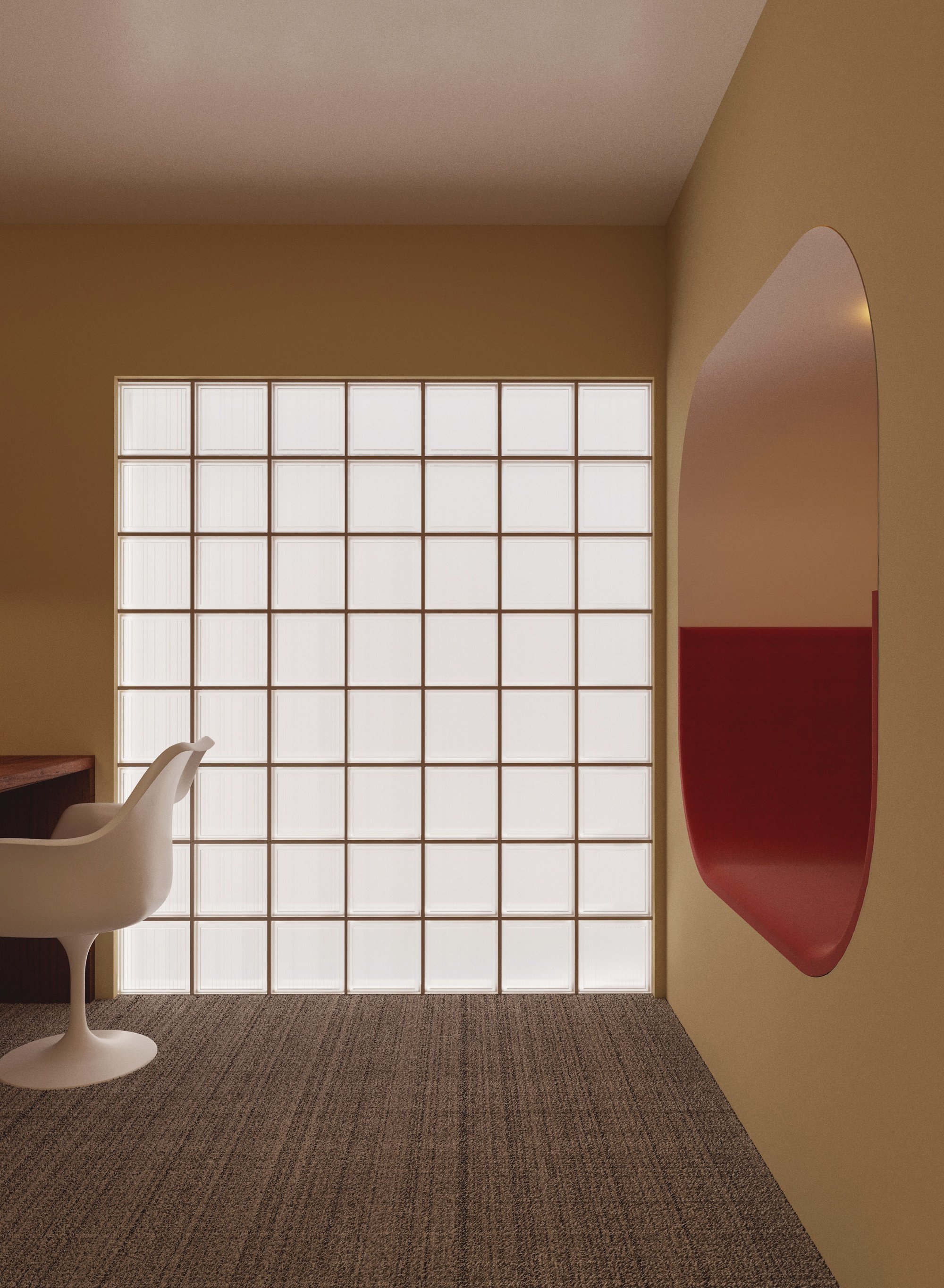 Glass blocks soften daylight against honey-coloured walls.